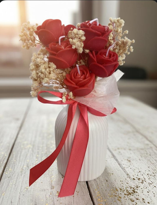 Rozen kaarsen in vaas